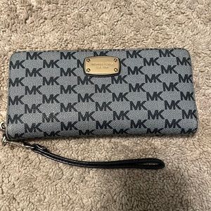 Michael Kords wrist wallet